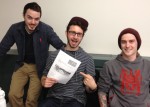 Carleton Campus Food Strategy Group Coordinator and two excited students showing off their paper on Campus Gardens! 